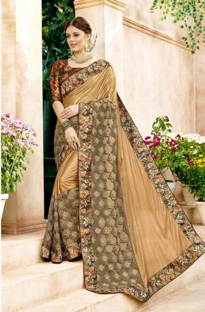 Celebrate This Festive Season Wearing This Designer Saree In Beige Color Paired With Brown Colored Blouse. This Saree Is Fabricated On Lycra And Net Paired With Art Silk Fabricated Blouse. Buy This Saree Now.
