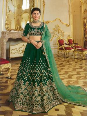 Catch All The Limelight Wearing This Heavy Designer Lehenga Choli At the Next Wedding You Attend. This Lehenga Choli Is In Dark Green Color Paired With Green Colored Dupatta. This Lehenga Choli Is Silk Based Paired With Orgenza Fabricated Dupatta. All Its Fabrics Gives A Rich And Elegant Look To Your Personality.