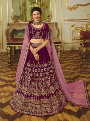 New Shade In Heavy Designer Lehenga Choli Is Here With This Pretty Wine Colored Lehenga Choli Paired With Pink Colored Dupatta. This Lehenga Choli Is Fabricated On Art Silk Paired With Orgenza Fabricated Dupatta. Its Fabrics Also Ensures Superb Comfort All Day Long. 