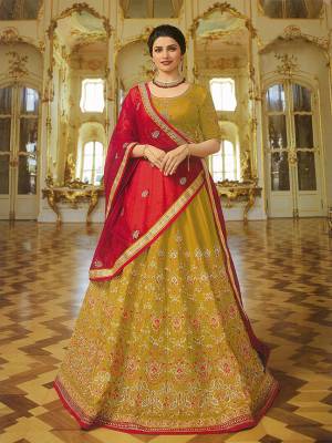 You will Definitely Earn Lots Of Compliments Wearing This Designer Heavy Lehenga Choli In Musturd Yellow Color Paired With Contrasting Red Colored Dupatta. Its Lehenga And Choli Are Silk Based Paired With Orgenza Fabricated Dupatta, Which Gives A Rich Look To Your Personality. 