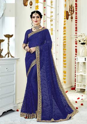 Bright And Visually Appealing Color Is Here With This Heavy Designer Saree In Royal Blue Color Paired With Royal Blue Colored Blouse. This Saree And Blouse Are Fabricated On Georgette Beautified With Tone to Tone Embroidery. Buy Now.