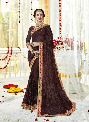 For A Bold And Beautiful Look, Grab This Designer Saree In Brown Color Paired With Brown Colored Blouse. This Saree And Blouse Are Fabricated On Georgette Beautified With Heavy Embroidery Work. 