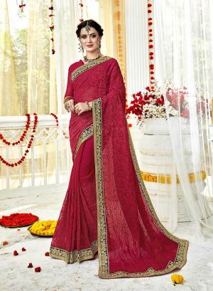 Catch All The Limelight At The Next Wedding You Attend Wearing This Designer Saree In Dark Pink Color Paired With Dark Pink Colored Blouse. This Saree And Blouse Are Fabricated On Georgette Beautified With Heavy Embroidery Work .