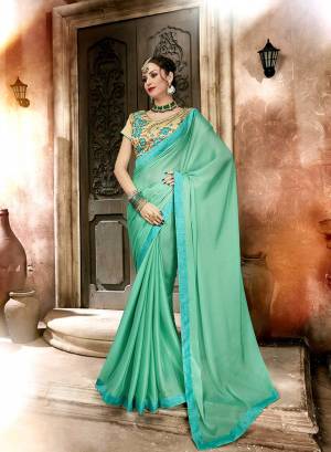 Here Is A Pretty Looking Designer Saree In Sea Green Color Paired With Beige Colored Blouse. This Saree Is Fabricated On Satin Georgette Paired With Art Silk Fabricated Blouse. It Has Embroidered Blouse With Plain And Elegant Looking Saree.