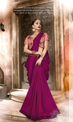 For A Designer Look, Grab This Saree In Magenta Pink Color Paired With A Contrasting Peach Colored Embroidered Blouse. This Saree Is Fabricated On Satin Georgette Paired With Art Silk Fabricated Blouse. It Is Easy To Drape And Carry All Day Long.