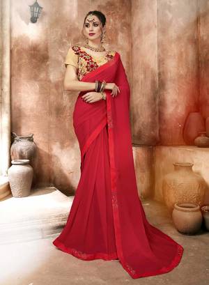 Here Is A Pretty Looking Designer Saree In Red Color Paired With Beige Colored Blouse. This Saree Is Fabricated On Satin Georgette Paired With Art Silk Fabricated Blouse. It Has Embroidered Blouse With Plain And Elegant Looking Saree.
