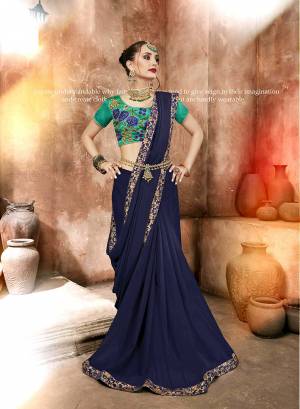 For A Designer Look, Grab This Saree In Navy Blue Color Paired With A Contrasting Sea Green Colored Embroidered Blouse. This Saree Is Fabricated On Satin Georgette Paired With Art Silk Fabricated Blouse. It Is Easy To Drape And Carry All Day Long.