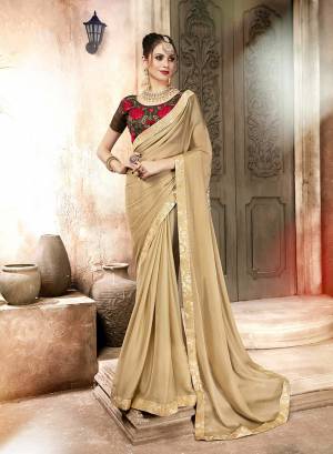 Proper Traditional Color Pallete Is Here For The Upcoming Festive Season. This Saree Is In Beige Color Paired With Brown Colored Blouse. This Saree Is Fabricated On Satin Georgette Paired With Art Silk Fabricated Embroidered Blouse. 