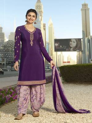 Bright And Visually Appealing Color Is Here With This Designer Suit In Dark Purple Colored Top Paired With Mauve Colored Bottom And Dupatta. Its Top And Bottom Are Crepe Fabricated Paired With Chiffon Dupatta. Buy Now.