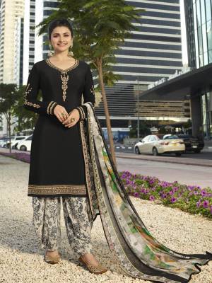 Enhance Your Personality Wearing This Designer Suit In Black Color Paired With White Colored Bottom And Dupatta. Its Top And Bottom Are Fabricated On Crepe Paired With Chiffon Dupatta. Its Fabrics Are Soft Towards Skin And Easy To Carry All Day Long. 