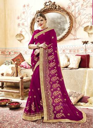 Shine Bright In This Beautiful Designer Saree In Magenta Pink Color Paired With Magenta Pink Colored Blouse. This Saree And Blouse Are Georgette Based Beautified With Jari And Thread Embroidery With Stone Work.