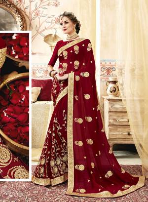 For A Royal Look, Grab This Designer Saree In Maroon Color Paired With Maroon Colored Blouse. This Saree And Blouse Are Georgette Based Beautified With Heavy And Attractive Embroidery All Over. 