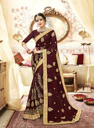 For A Royal Look, Grab This Designer Saree In Brown Color Paired With Brown Colored Blouse. This Saree And Blouse Are Georgette Based Beautified With Heavy And Attractive Embroidery All Over. 