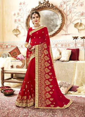 A Must Have Shade In Every Womens Wardrobe Is Here With This Designer Saree In Red Color Paired With Red Colored Blouse. This Saree And Blouse Are Fabricated On Georgette Beautified With Jari And Thread Embroidery With Stone Work. 