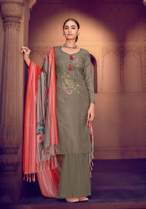 Olive Grey color muslin silk fabric suit comes with matching colored santoon Solid bottom with printed dupatta. This suit is covered with floral print with touc of thread work on top. Team it with a sandles to create a contrasting effect.