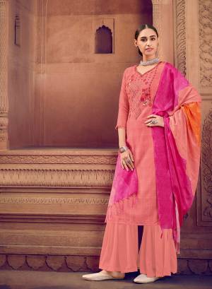 Peach color muslin silk fabric suit comes with matching colored santoon Solid bottom with printed dupatta. This suit is covered with floral print with touc of thread work on top. Team it with a sandles to create a contrasting effect.