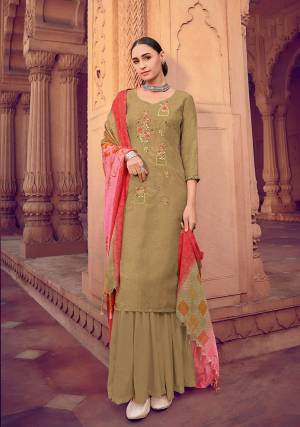 Olive Green color muslin silk fabric suit comes with matching colored santoon Solid bottom with printed dupatta. This suit is covered with floral print with touc of thread work on top. Team it with a sandles to create a contrasting effect.