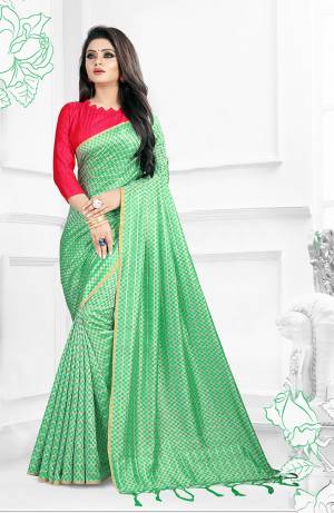 Grab This Beautiful Designer Saree In Sea Green Color Paired With Contrasting Dark Pink Colored Blouse. This Saree And Blouse Are Silk Based Beautified With 3D Checks Weave All Over It.