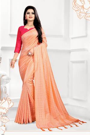 This Festive Season, Look The Most Amazing Of All In this Designer Light Orange Colored Saree Paired With Contrasting Dark Pink Colored Blouse. This Saree And Blouse Are Silk Based Beautified With 3D Checks Weave. 
