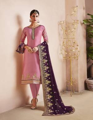 Look Pretty Wearing This Designer Straight Suit In Pink Color Paired With contrasting Purple Colored Dupatta. Its Heavy Embroidered Top Is Fabricated On Georgette Satin Paired With Santoon Bottom And Heavy Embroidered Orgenza Fabricated Dupatta. 