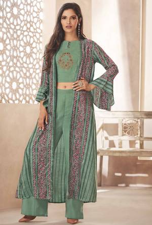 You Will Earn Lots Of Compliments Wearing This Designer Indo Western Set In Pretty Sea Green Color.  Its Top And Bottom Are Rayon Based Paired With Art Silk Fabricated Jacket. This Pretty Set Is Available In All Regular Sizes. Buy Now.