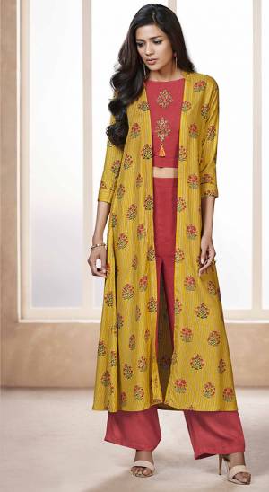 Celebrate This Festive Season Wearing This Designer Indo-Western Set In Dark Pink Color Paired With Contrasting Yellow Colored Jacket. Its Top, Bottom And Jacket Are Fabricated On Rayon Beautified With Prints And Embroidery. 