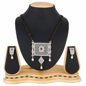 Give An Elegant Look To Your Neckline Wearing This Rich Delicate Patterned Designer Magalsutra Set. It Is Beautified With Pretty Diamond Work Giving It An Attractive Look. 