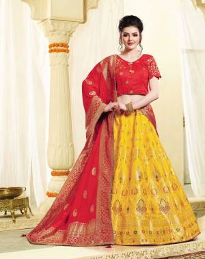 This Festive seaosn Look The Most Unique And Attractive Of All Wearing This Deisgner Lehenga Choli In Red Colored Blouse And Dupatta Paired With Yellow Colored Lehenga. This Silk bAsed Lehenga Gives A Rich And Elegant Look To Your Personality. 