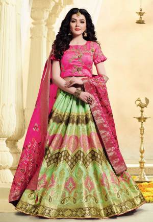 Look Pretty In This Pretty Evergreen Color Pallete With This Designer Lehenga Choli In Dark Pink Colorede Blouse And Dupatta paired With Contrasting Light Green Colored Lehenga. Its Pretty Colors And Rich Fabric Will Earn You Lots Of Compliments From Onlookers. 
