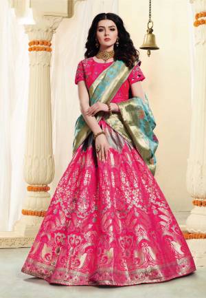 Bright And Visually Appealing Color Is Here With This Designer Lehenga Choli In Dark Pink Colored Lehenga  Paired With Contrasting Turquoise Blue Colored Dupatta. Its Blouse Is Art Silk Based Paired With Jacquard Silk Fabricated Lehenga And Dupatta. 