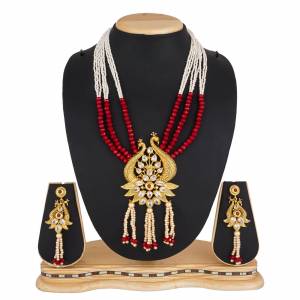 For A Queen Look, Here Is A Designer Royal Looking Necklace Set In Golden Color. This Necklace Set Can Be Paired With Heavy Ethnic Attire For More Enhanced Look. Buy Now