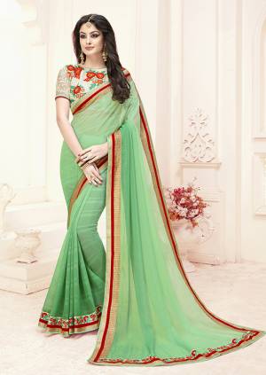 Here Is A Very Pretty Saree In Light Green Color Paired With Off-White Colored Blouse. This Saree Is Fabricated On Chiffon Paired With Art Silk Fabricated Blouse, It Has Multi Colored Thread Work Over The Blouse Making It More Attractive. 