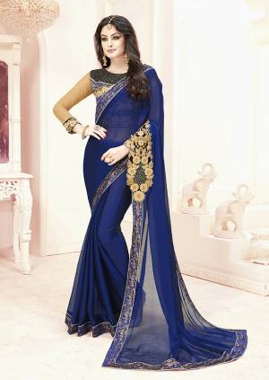 Catch All The Limelight Wearing This Designer Saree In Royal Blue Color Paired With Blue And Beige Colored Blouse. This Saree Is Fabricated On Chiffon Paired With Art Silk And Net Fabricated Blouse. It Has Beautiful Attractive Patch Work Over The Pallu. 