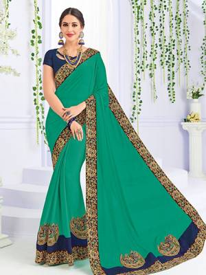 Attractively Gorgeous mesmerizing is what you will look at the next wedding gala wearing this beautiful Sea green color bright georgette saree. Ideal for party, festive & social gatherings. this gorgeous saree featuring a beautiful mix of designs. Its attractive color and heavy designer embroidered saree, patch design, stone design, beautiful floral design all over work over the attire & contrast hemline adds to the look. Comes along with a contrast unstitched blouse.