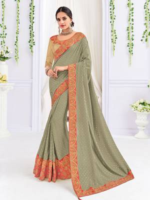 The fabulous pattern makes this saree a classy number to be included in your wardrobe. grey color silk fabrics saree. Ideal for party, festive & social gatherings. this gorgeous saree featuring a beautiful mix of designs. Its attractive color and heavy designer embroidered saree, stone design, beautiful floral design all over work over the attire & contrast hemline adds to the look. Comes along with a contrast unstitched blouse.
