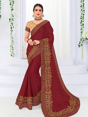 Wear this maroon color bright georgette saree. Ideal for party, festive & social gatherings. this gorgeous saree featuring a beautiful mix of designs. Its attractive color and heavy designer embroidered saree, patch design, stone design, beautiful floral design all over work over the attire & contrast hemline adds to the look. Comes along with a contrast unstitched blouse.