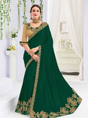 Presenitng  this Dark green color bright georgette saree. Ideal for party, festive & social gatherings. this gorgeous saree featuring a beautiful mix of designs. Its attractive color and heavy designer embroidered saree, patch design, stone design, beautiful floral design all over work over the attire & contrast hemline adds to the look. Comes along with a contrast unstitched blouse.
