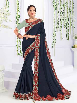 Look gorgeous in this beautiful printed Navy Blue color silk fabrics saree. Ideal for party, festive & social gatherings. this gorgeous saree featuring a beautiful mix of designs. Its attractive color and heavy designer embroidered saree, patch design, beautiful floral design all over work over the attire & contrast hemline adds to the look. Comes along with a contrast unstitched blouse.