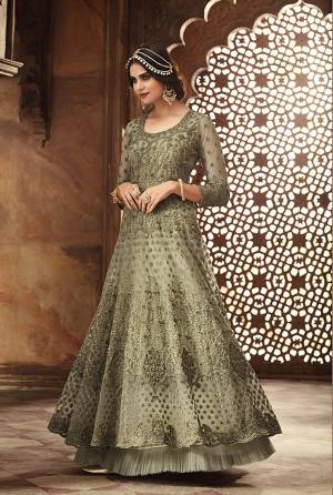 This Season Is About Subtle Shades And Pastel Play, So Grab This Heavy Deisgner Floo Length Suit In Pastel Green Color. Its Heavy Embroidered Top Is Net Based Paired With Santoon Bottom And Net Dupatta. Its Top Is Beautified With Heavy Resham Embroidery And Moti Work. 