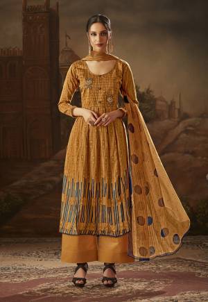 Here Is A Simple Dress Material For Your Semi-Casual Wear In Beige Color Paired With Beige Colored Bottom And Dupatta. This Dress Material Is Cotton Based Paired With Chiffon Dupatta. It Is Beautified With Prints And Thread Work. 