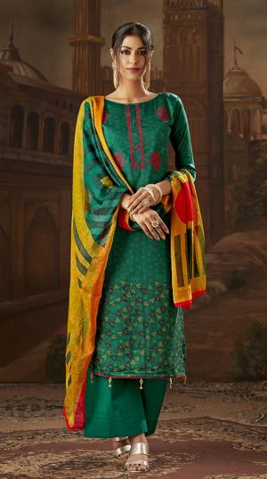 Grab This Pretty Suit For You Semi-Cauals In Pine Green Color Paired With Yellow And Pine Green Colored Dupatta. Its Top And Bottom Are Cotton Based Paired With Chiffon Dupatta. 