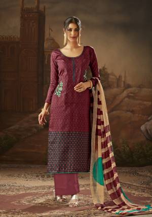 New Shade Is Here To Add Into Your Wardrobe With This Designer Dress Material In Wine Color Paired With Cream Colored Dupatta. It Is Cotton Based Paired With Chiffon Dupatta, Get this Stitched As Per your Desired Fit And Comfort. 