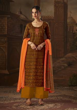 Go colorful With This Desiger Suit In Brown Colored Top Paired With Musturd Yellow Colored Bottom And Orange Colored Dupatta. This Dress Material Is Cotton Based Paired With Chiffon Fabricated Dupatta. All Its Fabric Ensures Superb Comfort All Day Long. 