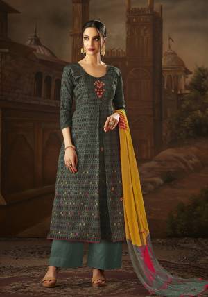 New Shade Is Here To Add Into Your Wardrobe With This Designer Dress Material In Teal Grey Color Paired With Yellow & Grey Colored Dupatta. It Is Cotton Based Paired With Chiffon Dupatta, Get this Stitched As Per your Desired Fit And Comfort. 