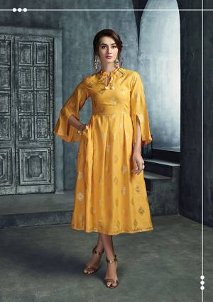 Celebrate This Festive Season With Beauty And Comfort Wearing This Classy And Elegant Readymade Kurti In Yellow Color Fabricated On Rayon Beautified With Foil Prints Butti And A Pretty Sleeve Pattern. Buy Now.