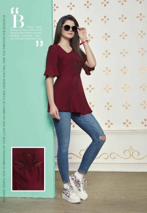 Grab This Readymade Top For Your College Wear, Work Place Or For An Outing. This Lovely Maroon Colored Top Is Fabricated On Muslin Cotton Which Is Light Weight And Easy To Carry All Day Long. 
