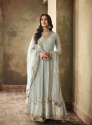 This Festive And Wedding Season, Catch All The Lime Light Wearing This Designer Indo Western Suit In Pretty Baby Blue Color. Its Top Is Fabricated On Georgette Paired With Santoon Bottom And Net Fabricated Dupatta. Also It Comes With A Stitched Sharara So That You Can Wear It In Two Ways As Per The Occasion. 