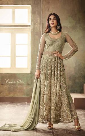 it?s the Season Of Subtle Shades And Pastel Play. So Grab This Designer Suit In Pastel Green Color Paired With Same Colored Bottom And Dupatta. Its Top Is Fabricated On Net Paired With Santoon Bottom And Net Dupatta. Also It Comes With A Comes A Semi-Stitched Koti For Two Looks. Buy Now.