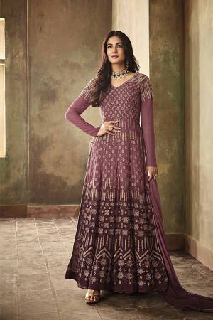 Have A Rich And Poised Look, Wearing This Designer Floor Length Suit In Purple Color. Its Beautiful Embroidered Top Is Fabricated On Georgette Paired With Santoon Bottom And Chiffon Fabricated Dupatta. Buy This Suit Now.