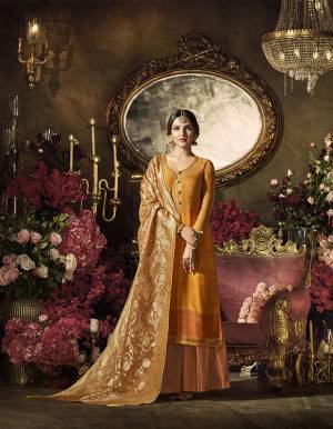 Celebrate This Festive With Some Bright Color Wearing This Designer Suit In Musturd Yellow Colored Top Paired With Peach Colored Bottom And Dupatta. Its Top Is Fabricated On Satin Georgette Paired With Santoon Bottom And Banarasi Art Silk Dupatta. You Can Get Its Bottom Stitched As Salwar, Pants Or Plazo As Per Your Comfort. 